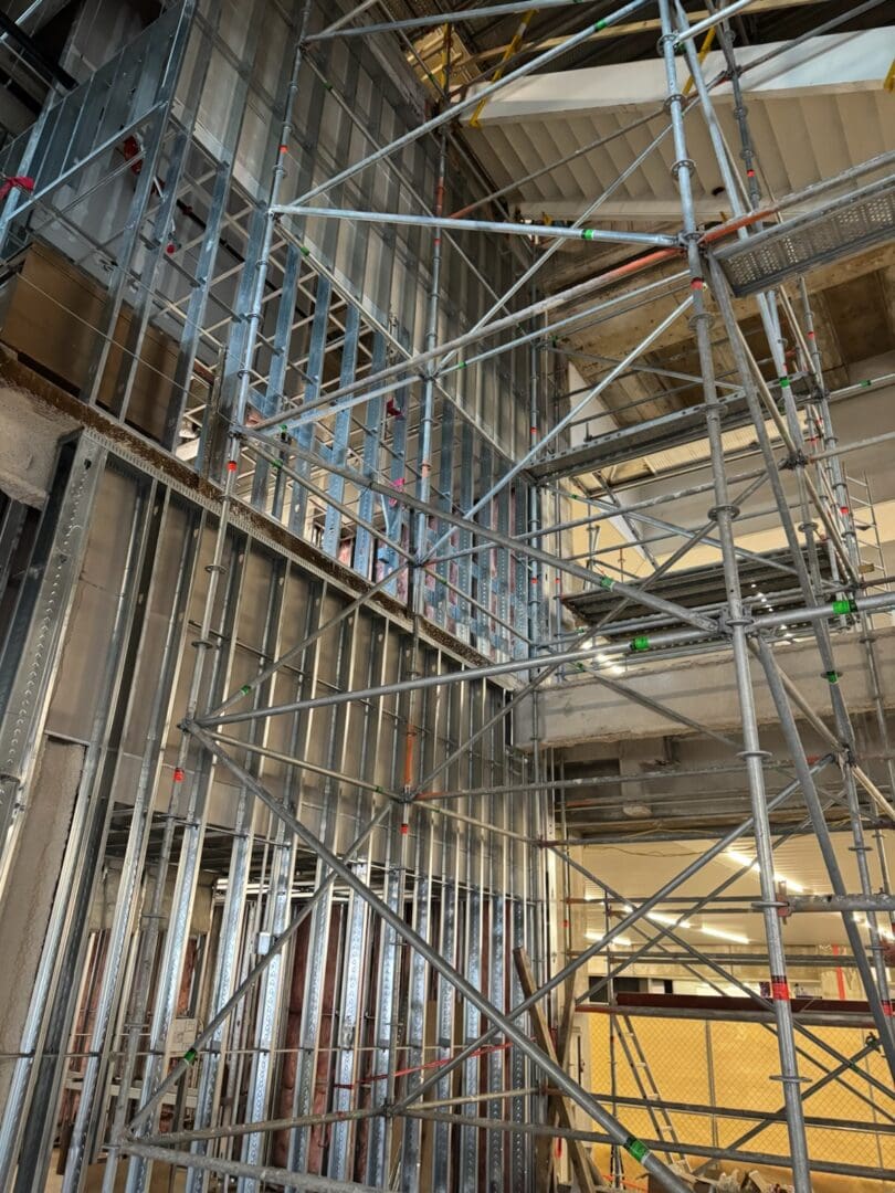 Scaffolding and metal framing in a building under construction.